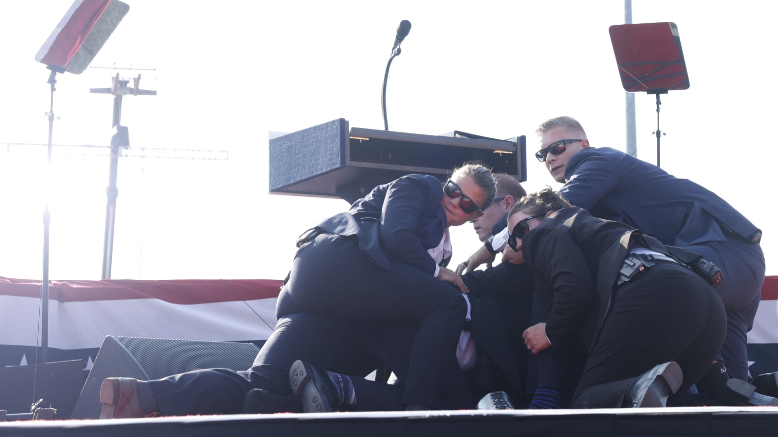 Republican presidential candidate former President Donald Trump is rushed offstage during a rally on July 13, 2024 in Butler, Pennsylvania. 