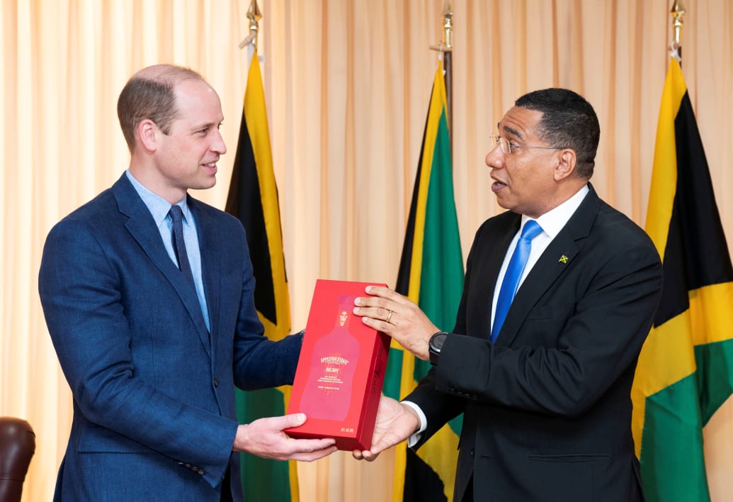 Jamaica's Prime Minister Andrew Holness presents Britain's Prince William with a bottle of Appleton Estate Ruby during a meeting at his office, on day five of the Platinum Jubilee Royal Tour of the Caribbean, in Kingston, Jamaica, March 23, 2022.