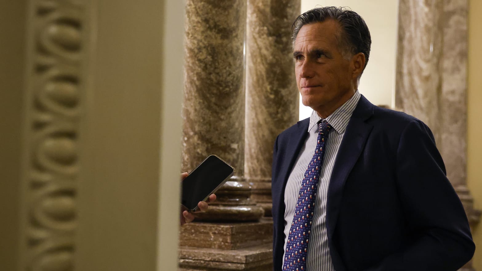 Mitt Romney speaks to a reporter in D.C.