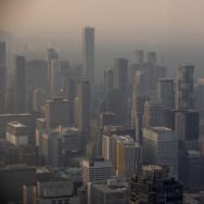 A smokey Toronto skyline is seen from the CN Tower as wildfires in Ontario and Quebec continue to burn, in Toronto, Ontario, Canada, June 6, 2023.