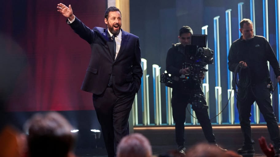 Actor and comedian Adam Sandler waves as he is awarded the Mark Twain Prize for American Humor at the Kennedy Center in Washington, D.C., March 19, 2023.