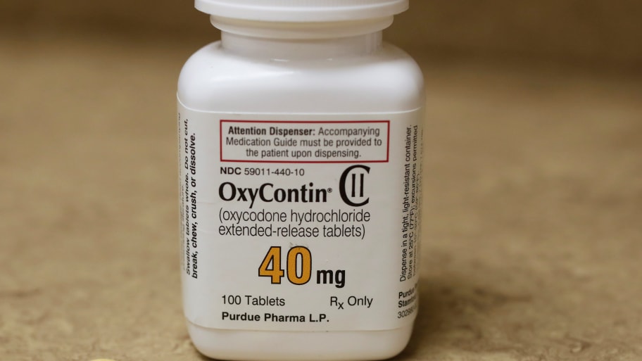 A bottle of prescription painkiller OxyContin, 40mg pills, made by Purdue Pharma L.D. sit on a counter at a local pharmacy, in Provo, Utah