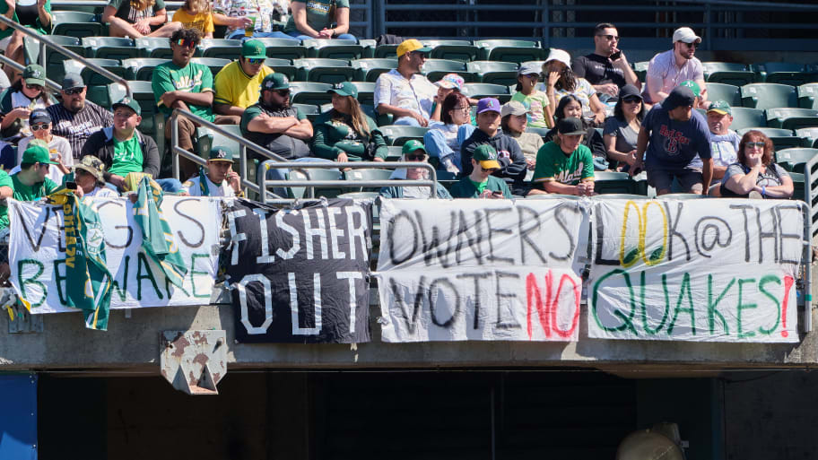 Fans in the outfield bleachers display signs critical of Oakland Athletics ownership during the second inning against the Detroit Tigers at Oakland-Alameda County Coliseum, Sep. 24, 2023.