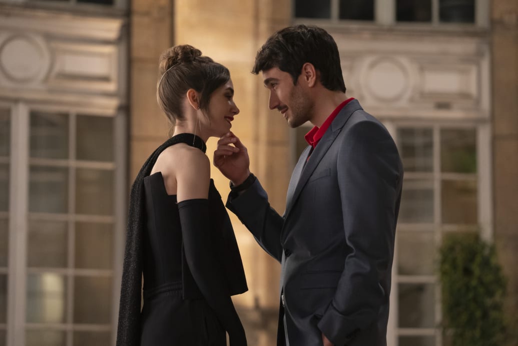 A photo still of Lily Collins and Eugenio Franceschini in Emily in Paris