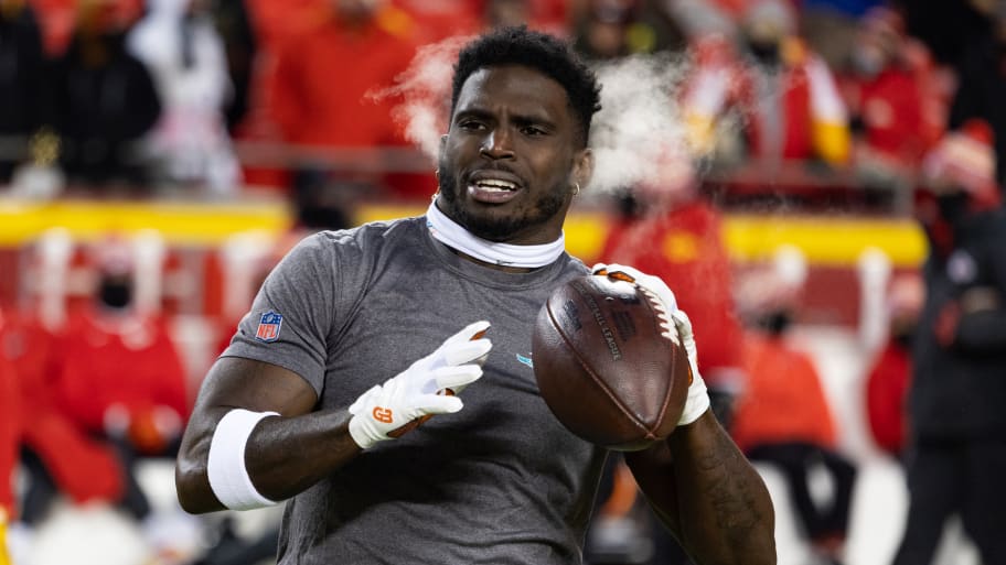 Tyreek Hill #10 of the Miami Dolphins warms up before an NFL wild-card playoff football game at GEHA Field at Arrowhead Stadium on January 13, 2024 in Kansas City, Missouri.