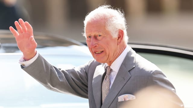 King Charles III waves to wellwishers as he departs Southport Town Hall after meeting members of the community and emergency services on August 20, 2024 in Southport, England. 