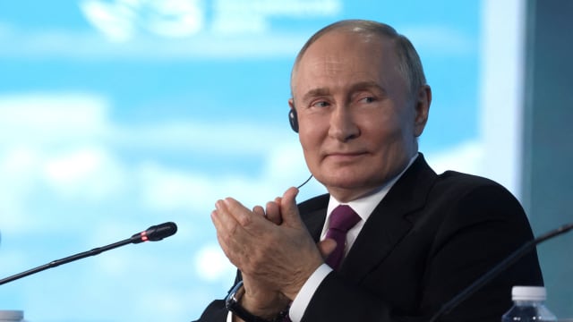 Vladimir Putin claps while smiling lightly at the the Eastern Economic Forum in Vladivostok, Russia on September 5, 2024