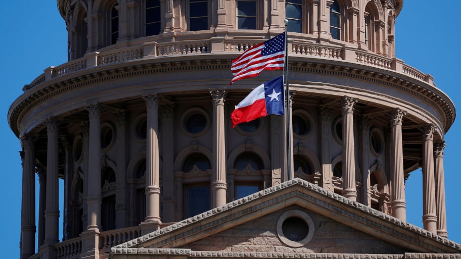 The U.S flag and the Texas State flag fly over the Texas State Capitol in Austin, Texas, U.S., March 14, 2017.
