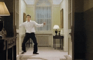gif of Hugh Grant dancing in the hall in a scene from 'Love Actually' 