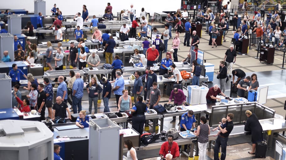 Lines of airplane passengers proceed through the TSA security checkpoint at Denver International Airport in Denver, Colorado.