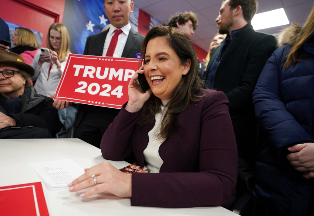 Rep. Elise Stefanik (R-NY) works the phone while visiting with volunteers at Team Trump New Hampshire Headquarters ahead of the state's nominating contest in Manchester, New Hampshire.