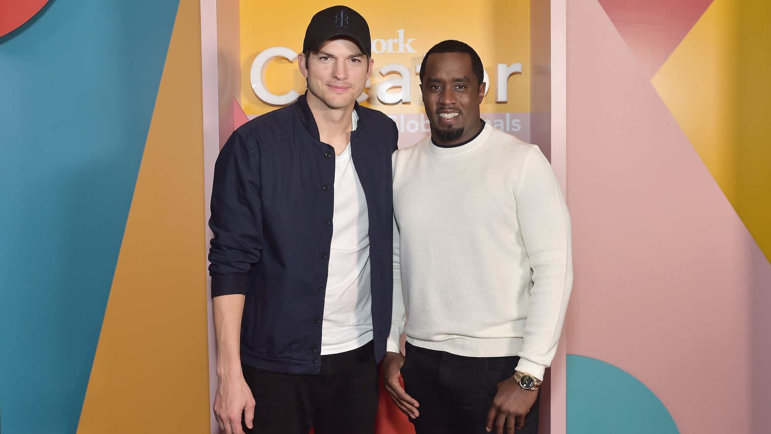 Ashton Kutcher (L) and Sean Combs in 2019. 