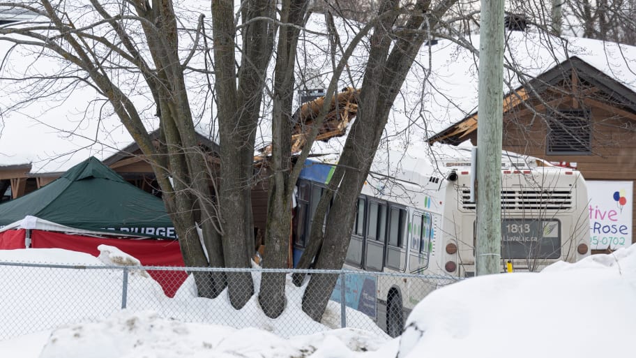 A Laval city bus crashed into a daycare amid a snowy area and fence