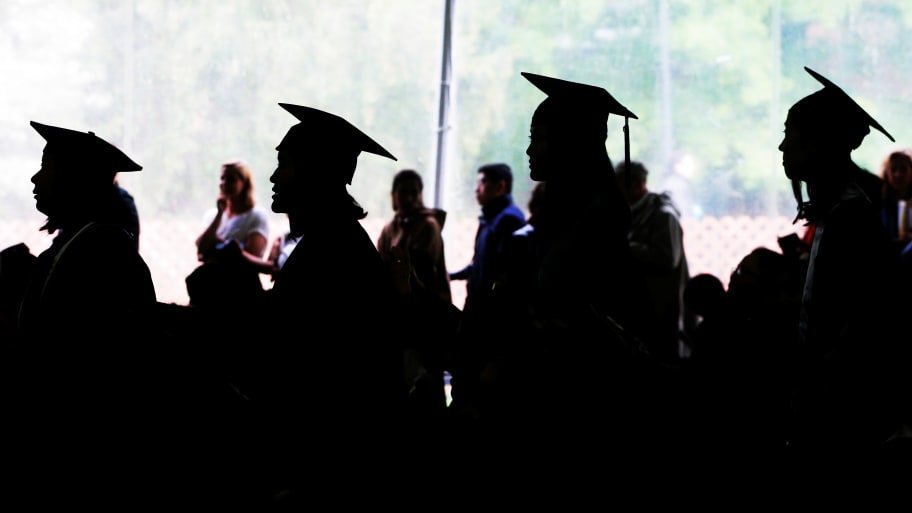 Graduating seniors line up to receive their diplomas during Commencement at Wellesley College in Wellesley.
