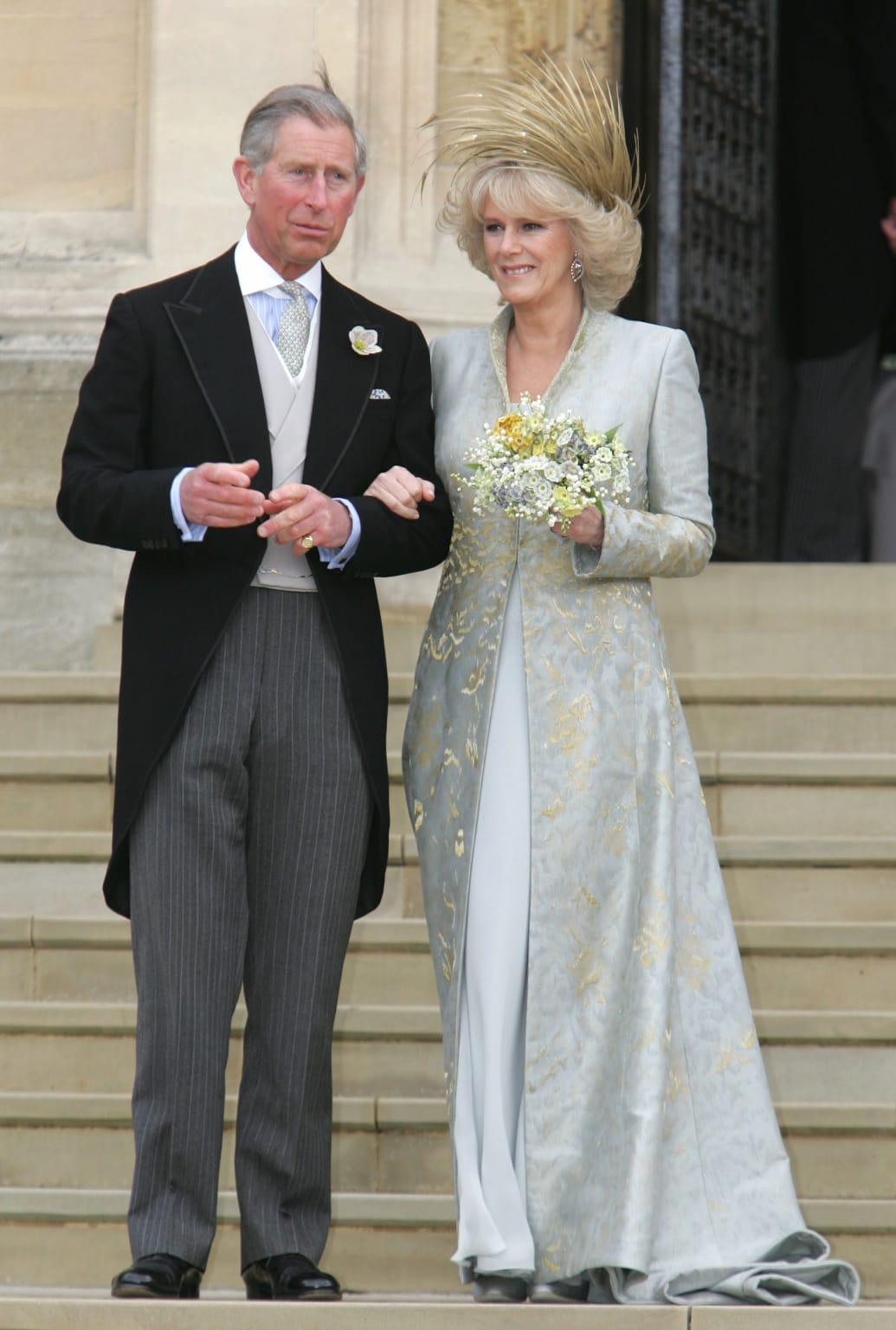 Britain's Prince Charles and Camilla, Duchess of Cornwall, pose outside St. George's Chapel in Windsor Castle, southern England, after the Service of Prayer and Dedication following their marriage, April 9, 2005.