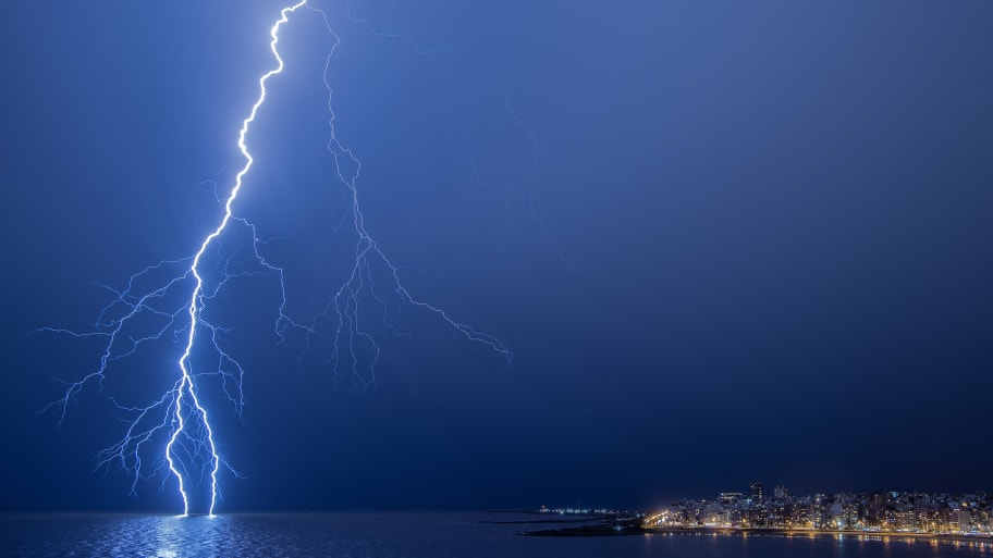  A lightning strikes during a thunderstorm in Montevideo on March 12, 2024.