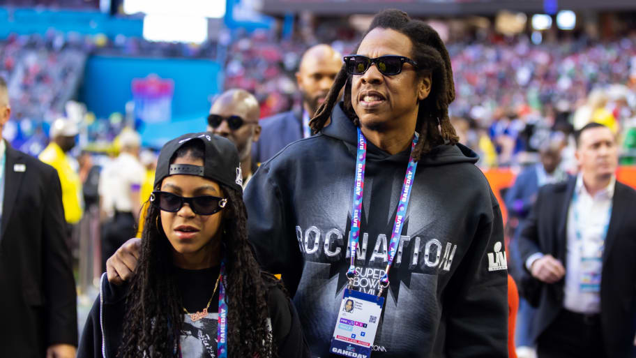 Jay-Z and daughter Blue Ivy on the sideline before Super Bowl LVII