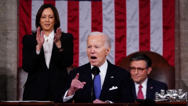 Joe Biden speaks from a podium during the State of the Union.