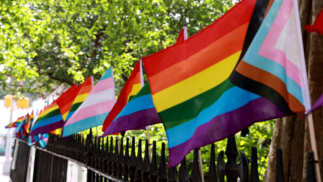 MANHATTAN - NY - June 12, 2023 - Rainbow flags are pictured flying on the fence at the Stonewall National Monument in Christopher Park on Christopher Street Monday afternoon.