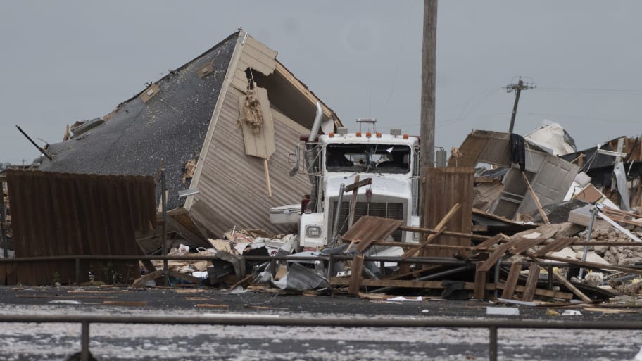 A semi truck sits among the rubble after a tornado struck the American Budget Value Inn in El Reno, Oklahoma.