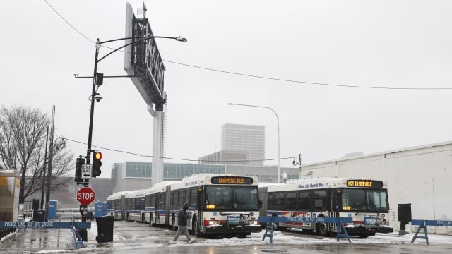 Chicago Transit Authority (CTA) warming buses sit at the migrant landing zone during a winter storm on January 12, 2024 in Chicago, Illinois. 