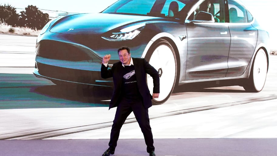Tesla Inc CEO Elon Musk dances onstage during a delivery event for Tesla China-made Model 3 cars in Shanghai.