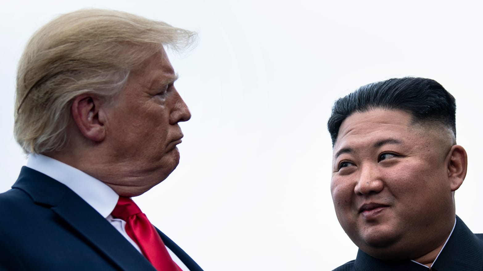 U.S. President Donald Trump and North Korea's leader Kim Jong-un talk before a meeting in the Demilitarized Zone on June 30, 2019.