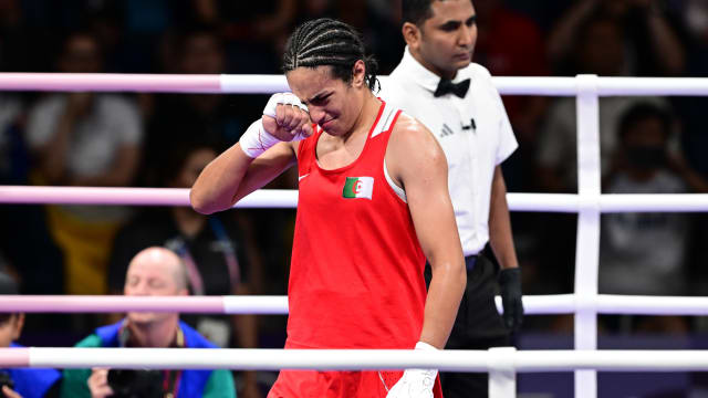 Imane Khelif (red) of Team Algeria competes against Anna Luca Hamori (blue) of Team Hungary.