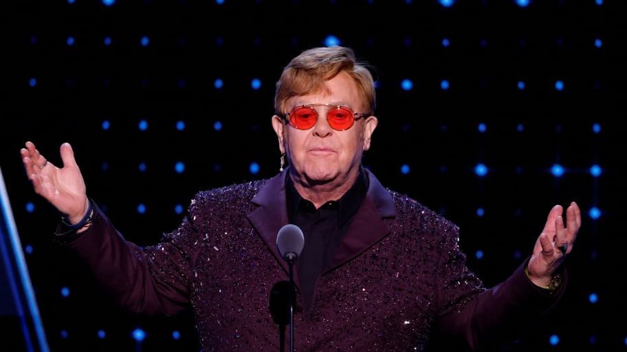 Elton John gestures as he presents the Musical Excellence Award for Bernie Taupin during the 38th Annual Rock & Roll Hall of Fame Induction Ceremony in Brooklyn, New York, U.S., November 3, 2023.