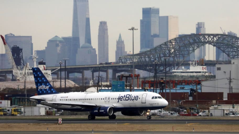 A JetBlue flight from London to New York was reportedly disrupted by a drunk passenger who was restrained by other people on board. 