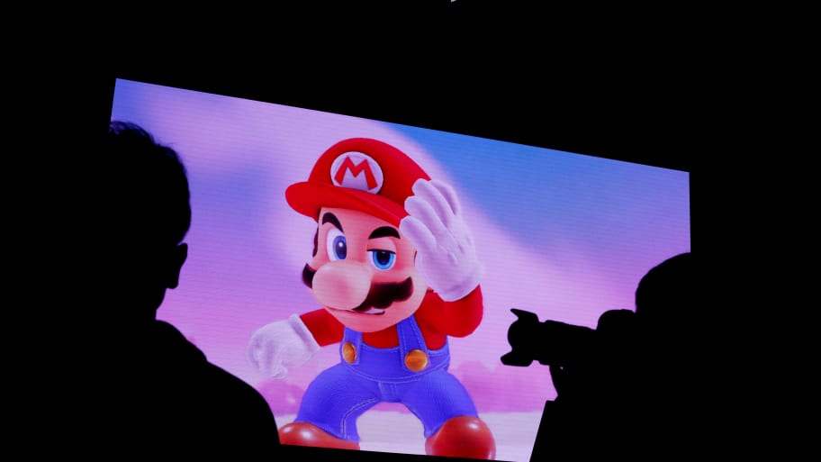 Nintendo's game character Super Mario is seen on a screen at the presentation ceremony of Nintendo's game console Switch.