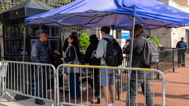 People check in at a security tent at Columbia University on April 24, 2024 in New York City. 
