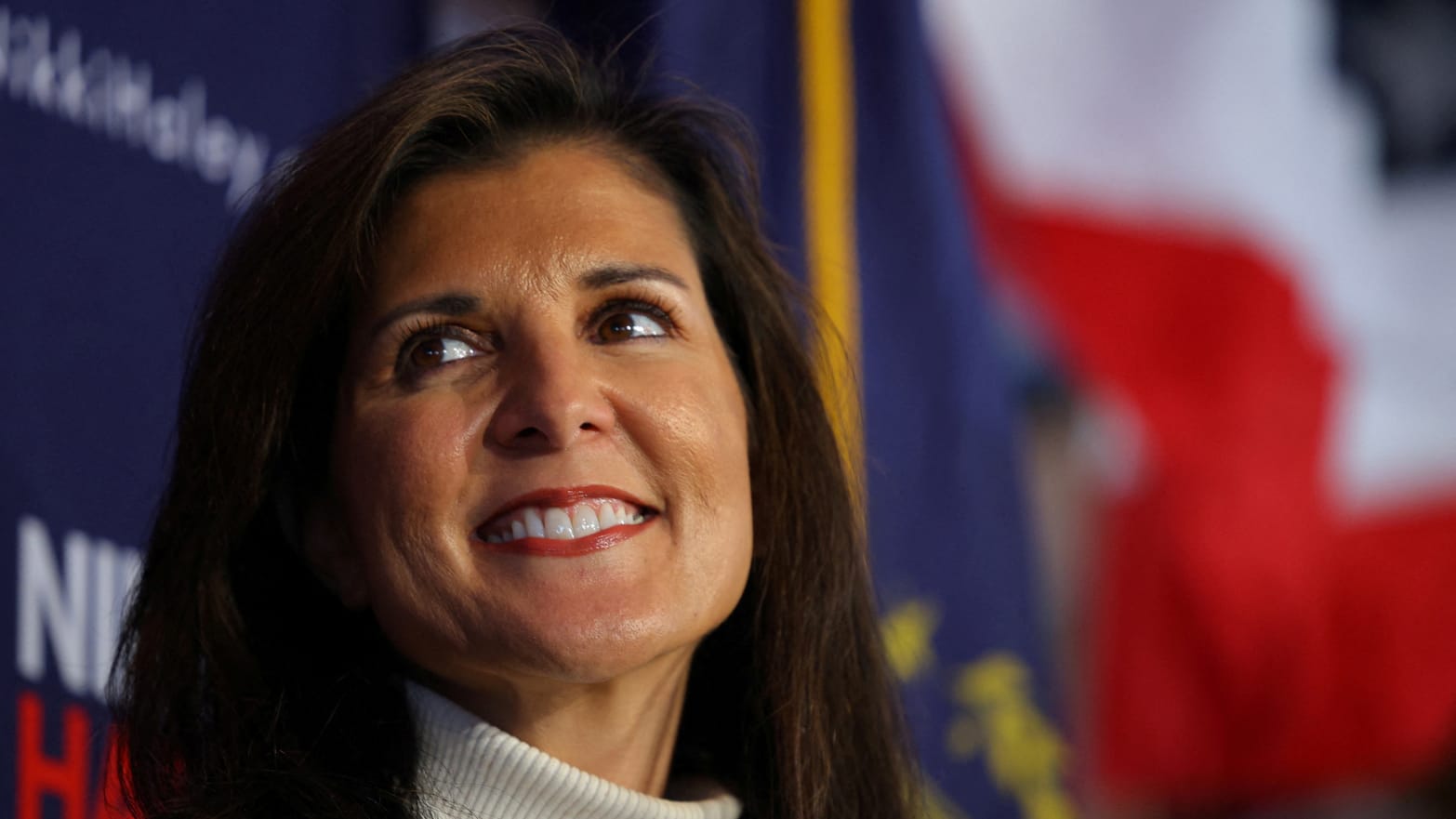 Republican presidential candidate and former U.S. Ambassador to the United Nations Nikki Haley listens as she is introduced during a campaign stop in Hooksett, New Hampshire, Nov. 20, 2023.   
