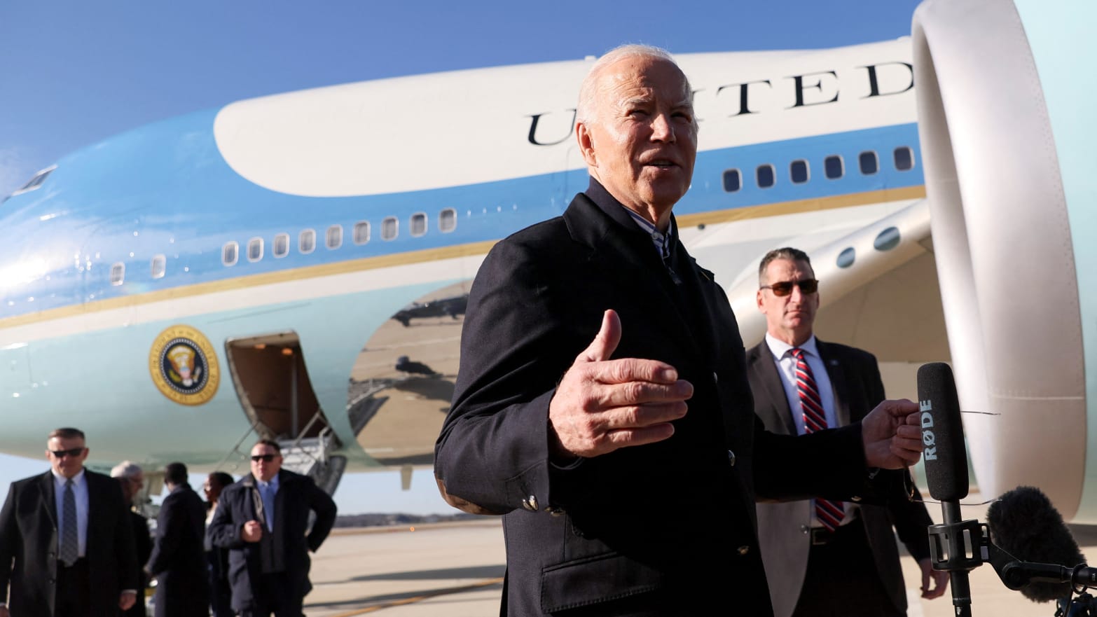 Joe Biden speaks to reporters outside Air Force One.