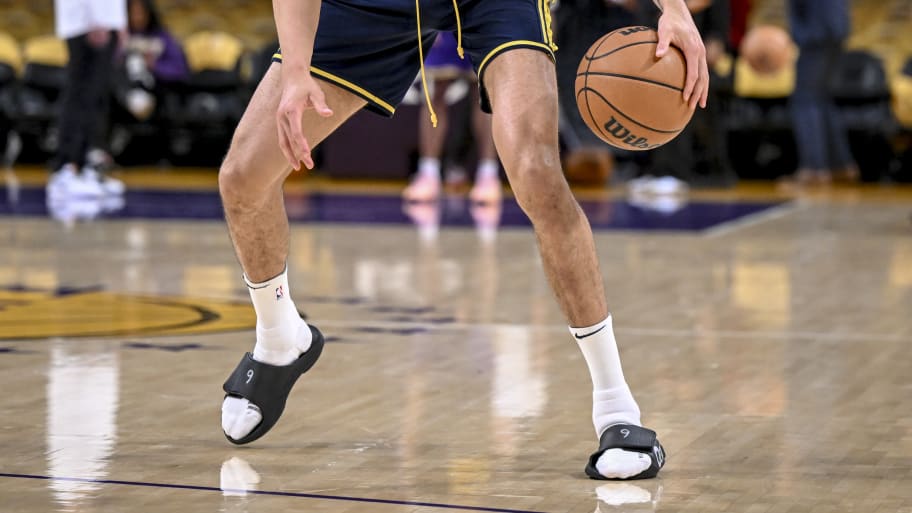 Michael Porter Jr. (1) of the Denver Nuggets warms up in slides before the first half against the Los Angeles Lakers at Crypto.com Arena in Los Angeles on Saturday, April 27, 2024.