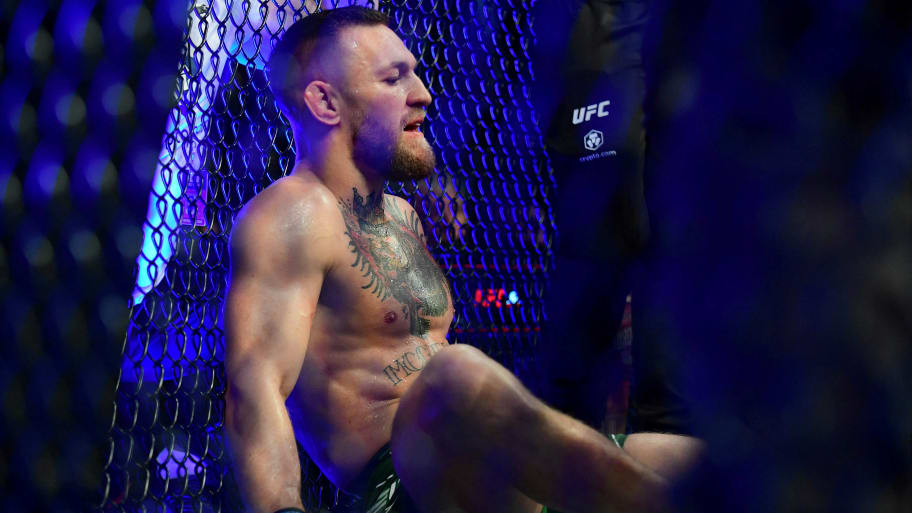 Conor McGregor reacts following an injury suffered against Dustin Poirier.