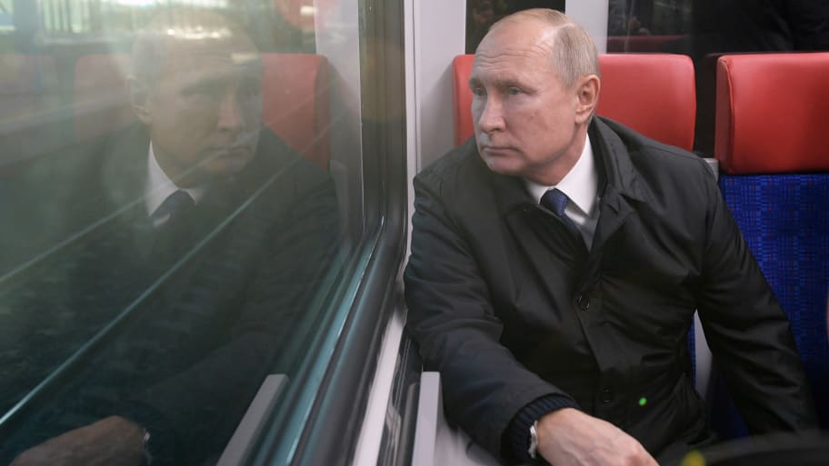 Vladimir Putin looks out the window of a new train as he takes part in the launch of the Moscow Central Diameters network in Moscow, Russia, Nov. 21, 2019. 