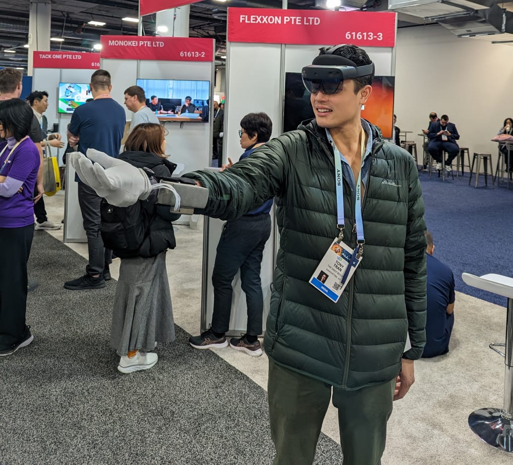 Tony Ho Tran holds a beating heart with a haptic glove from Microtube Tech in virtual reality. 
