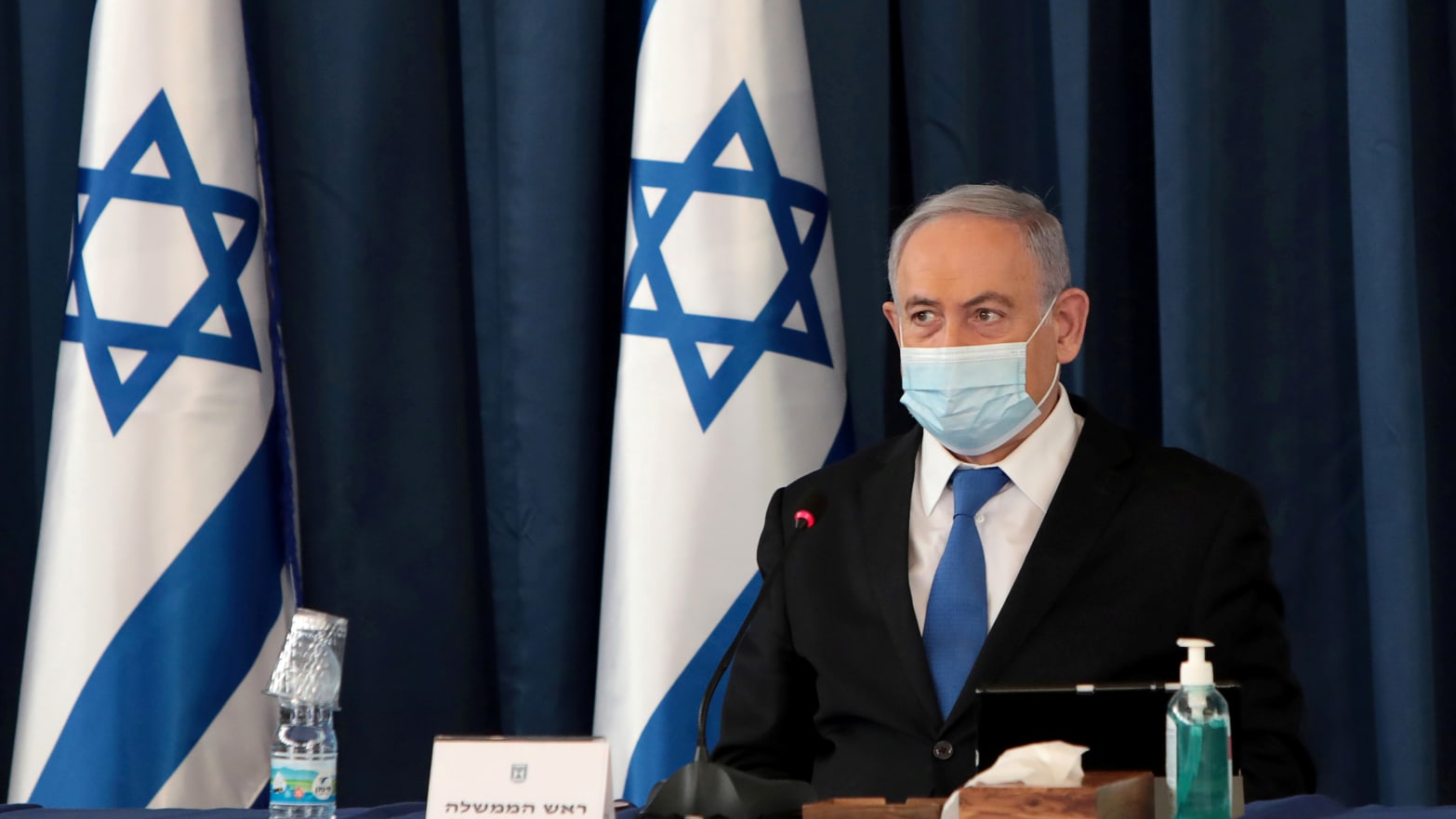 FILE PHOTO: Israeli Prime Minister Netanyahu wears a protective mask, amid the spread of the coronavirus disease (COVID-19), as he holds a weekly cabinet meeting at the Foreign Ministry in Jerusalem, July 5, 2020.