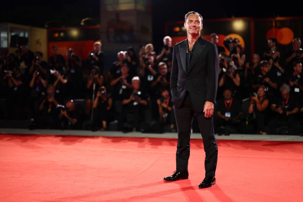 Jude Law poses on the red carpet during the Venice Film Festival on August 31, 2024.