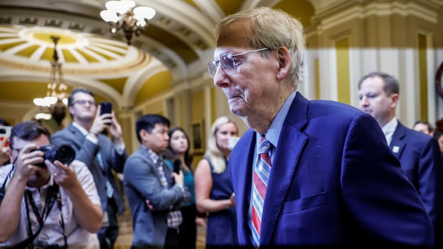 Mitch McConnell walks to the U.S. Senate floor on Tuesday.