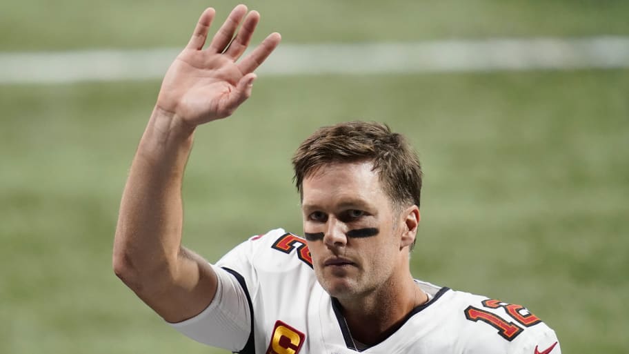Tom Brady waves after defeating the Atlanta Falcons in a NFL game at Mercedes-Benz Stadium.