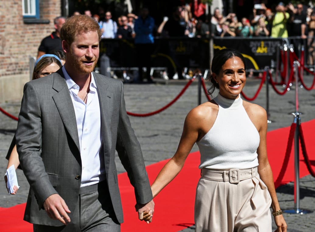 Prince Harry and Meghan Markle walk in front of the City Hall as they attend the event 'One year to go' ahead of the 2023 Invictus Games in Duesseldorf, Germany, September 6, 2022.