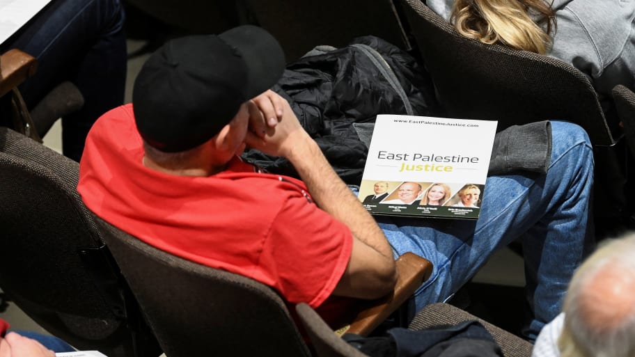 A person holds an informational publication about the train derailment in East Palestine, Ohio.