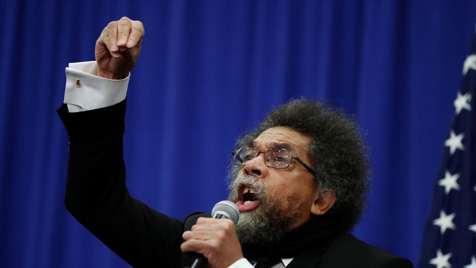 Political activist Cornel West addresses the record of U.S. Democratic presidential candidate Bernie Sanders on African-American issues during a town hall in Flint, Michigan