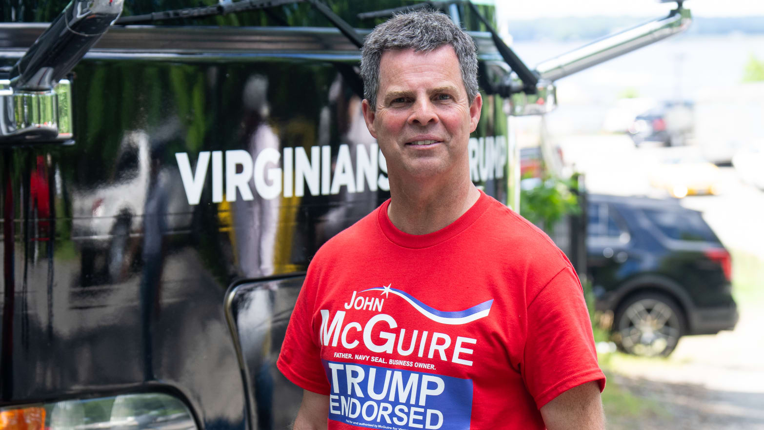 GOP candidate for Virginia's 5th Congressional district John McGuire returns to his campaign bus after meeting voters at the Annual Father's Day Carshow at the Pleasants Landing at Lake Anna in Bumpass, Va., on Saturday, June 15, 2024