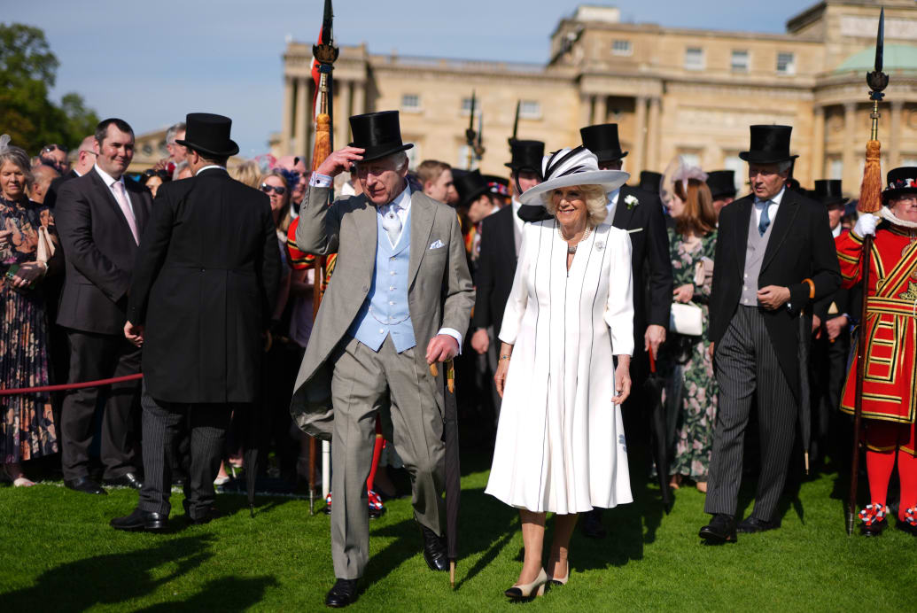 King Charles III and Queen Camilla attending a Royal Garden Party at Buckingham Palace on May 8, 2024 in London, England.