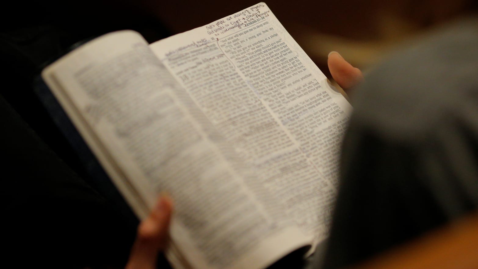 A woman reads her bible before the Exalt Showcase of gospel and Christian music at Central Presbyterian Church at the South by Southwest (SXSW) Music Film Interactive Festival 2017 in Austin, Texas, U.S., March 14, 2017.