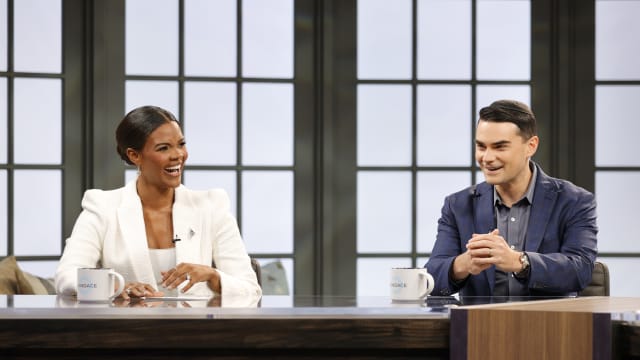 Candace Owens and Ben Shapiro sit on the set of a podcast together.