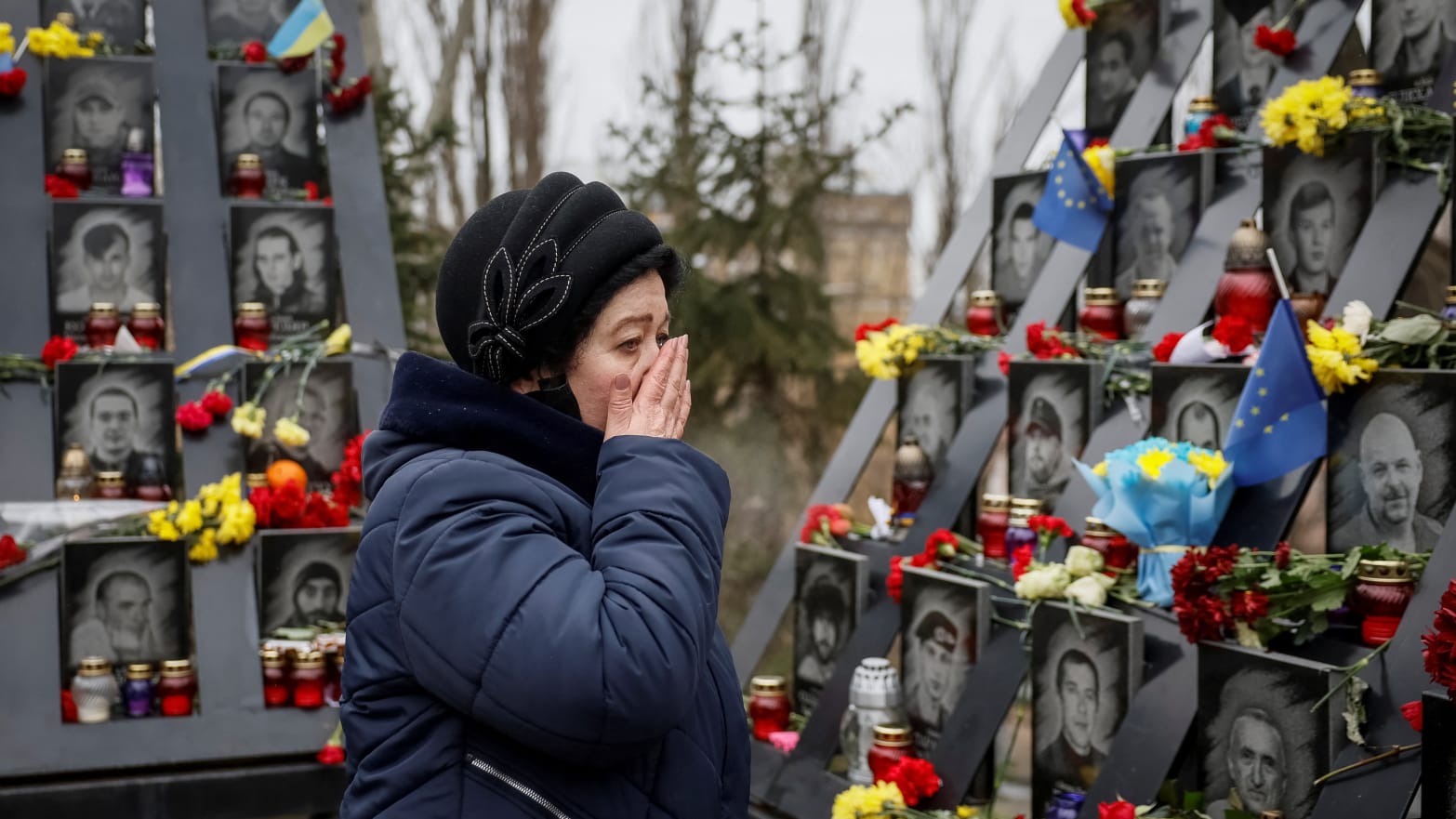A woman reacts as she visits at a monument to the so-called \"Heavenly Hundred\", the people killed during the Ukrainian pro-European Union (EU) mass demonstrations in 2014, to mark the tenth anniversary of the end of the uprising.